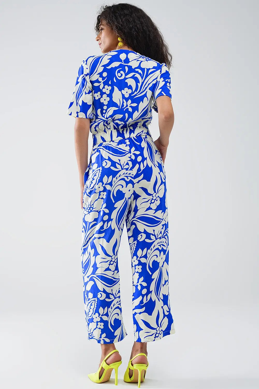 Short Sleeve Key Hole Front Floral Jumpsuit In Blue - Jumpsuits