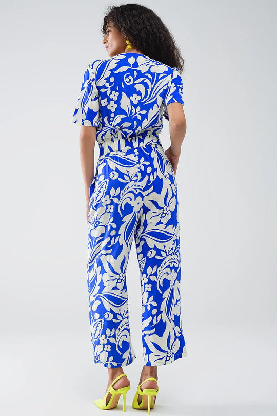 Short Sleeve Key Hole Front Floral Jumpsuit In Blue - Jumpsuits
