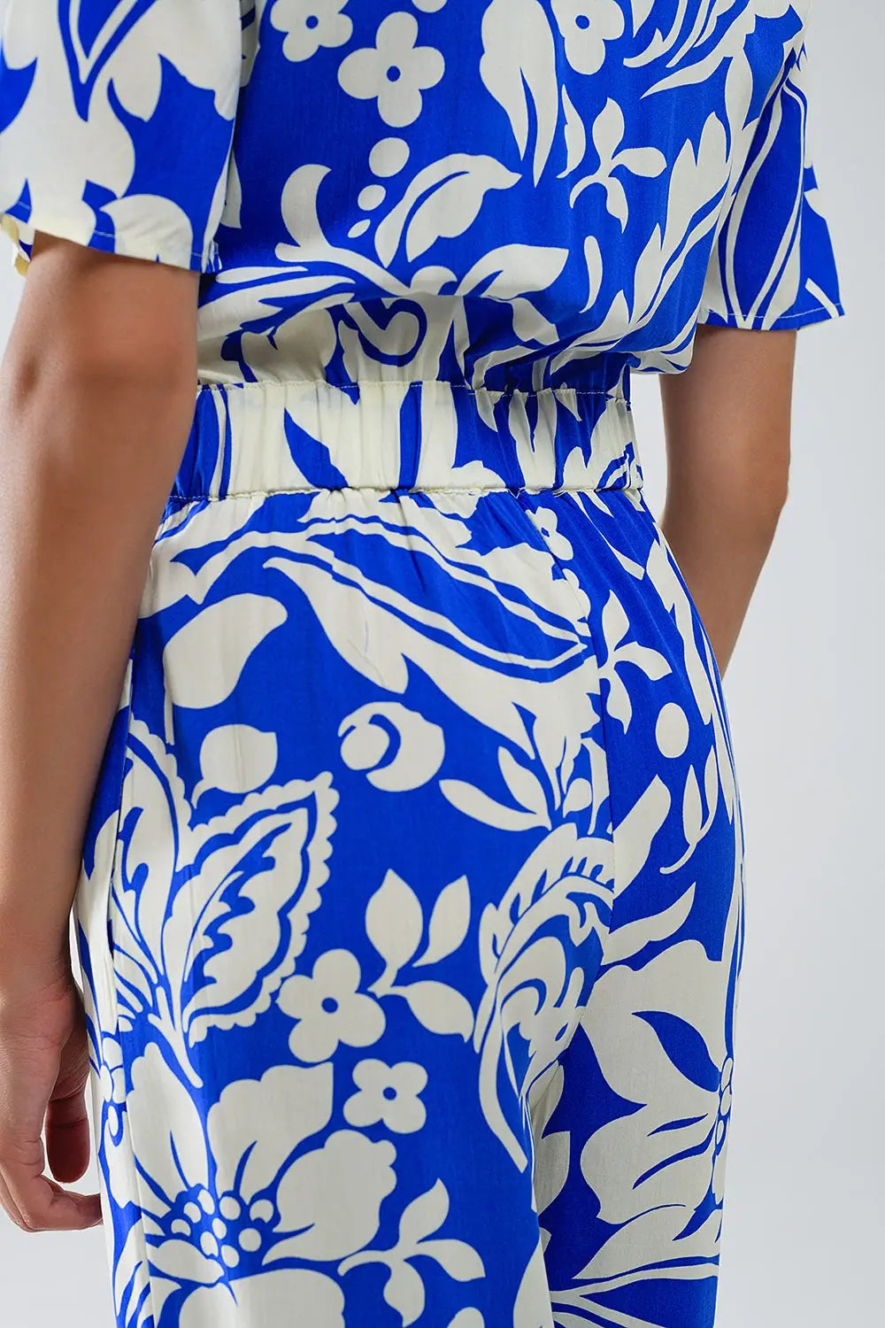 Short Sleeve Key Hole Front Floral Jumpsuit In Blue - Jumpsuits