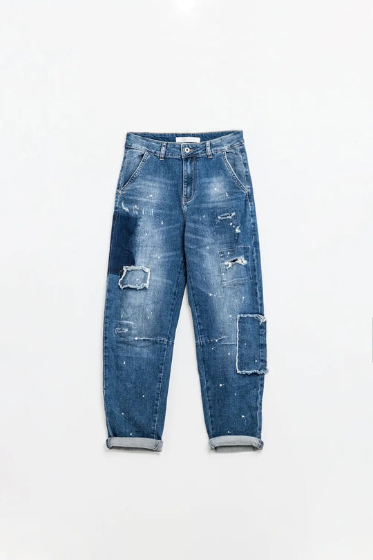 Loose-fitting jeans with distressed patches and paint details