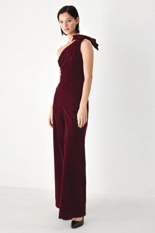 BERRY AFTER DARK VELVET BOW ONE-SHOULDER JUMPSUIT