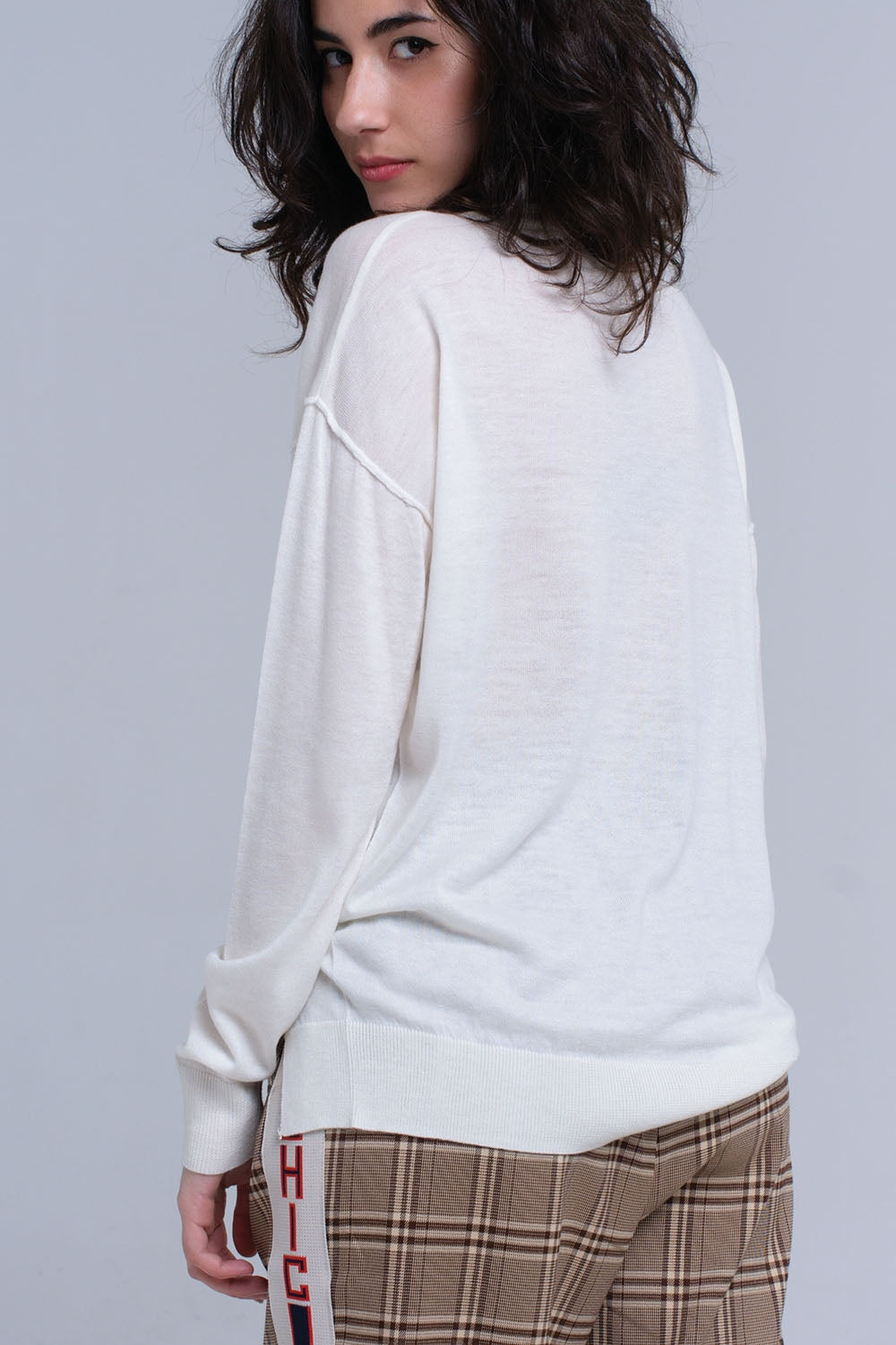 Asymmetric sweater in cream