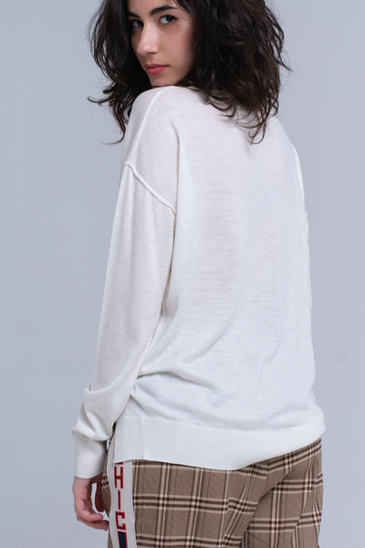 Asymmetric sweater in cream