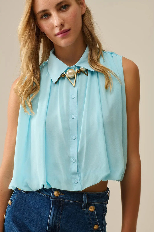 Q2 baby blue chiffon blouse with pleats at the hem