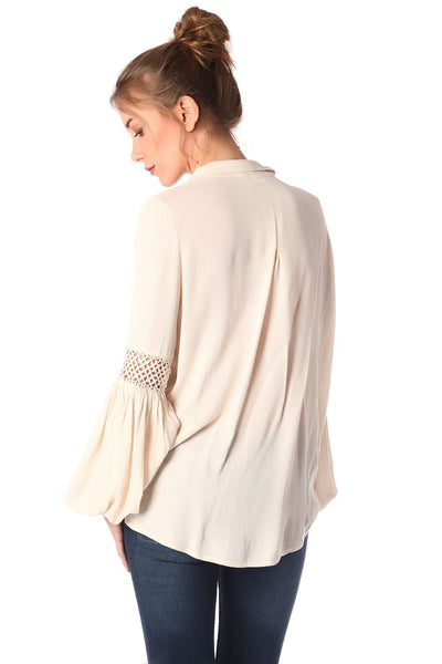 Beige blouse with wrap front and draped detail