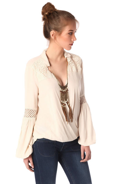 Q2 Beige blouse with wrap front and draped detail