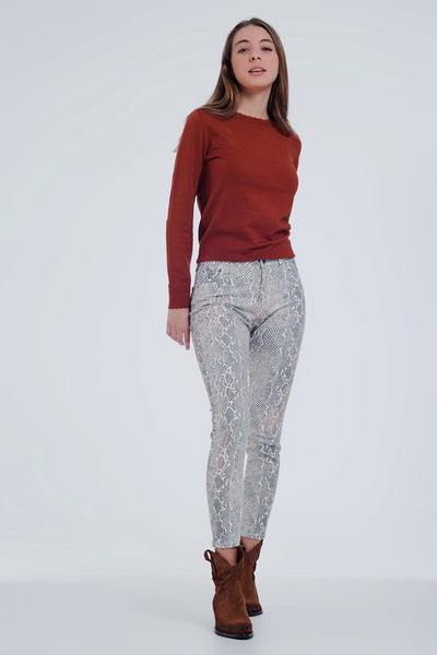 beige coloured pants with snake print