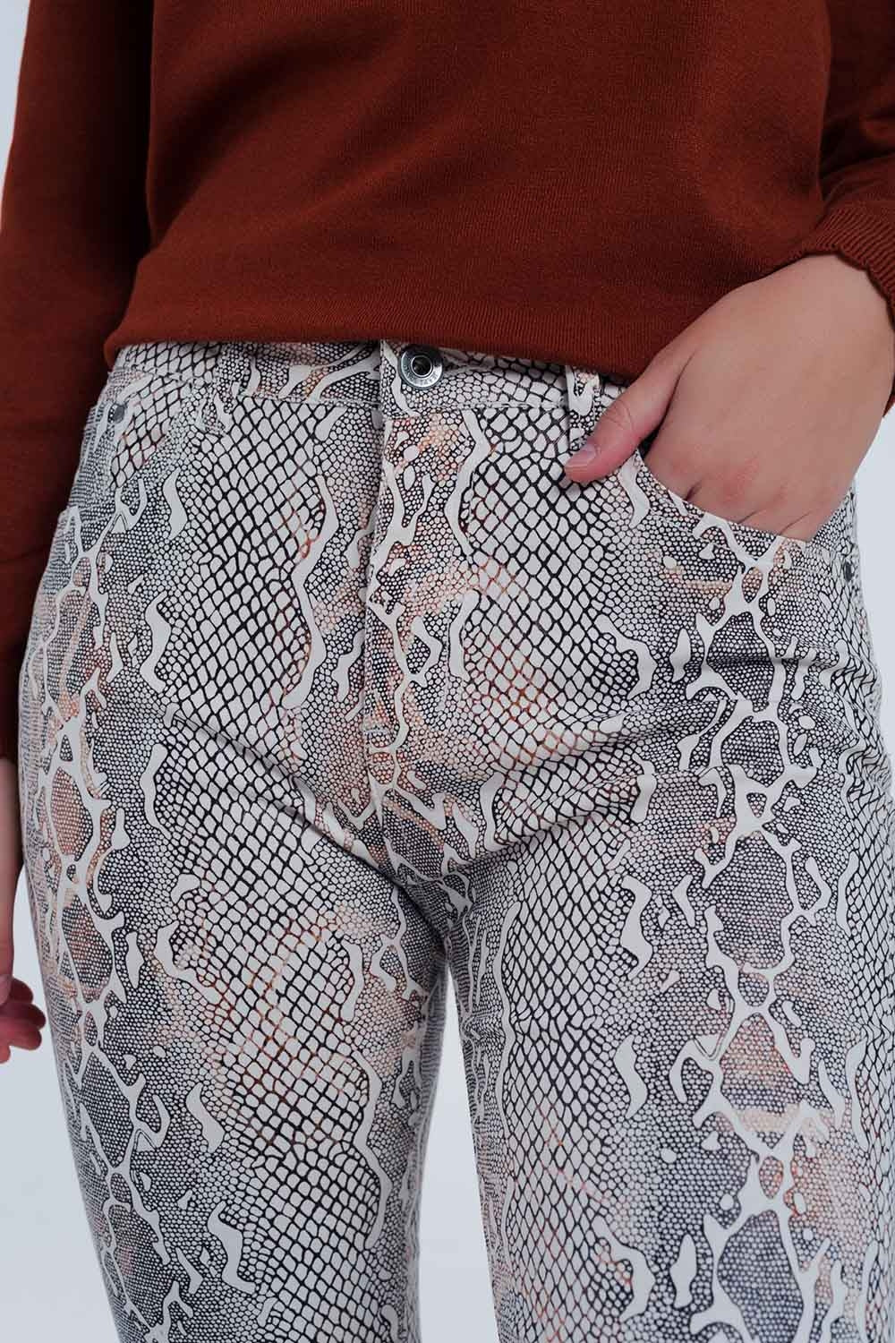 beige coloured pants with snake print