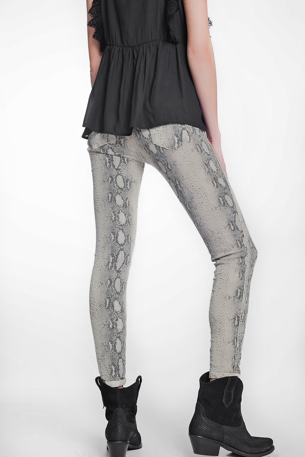 beige super skinny reversible pants with snake print