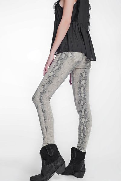 beige super skinny reversible pants with snake print