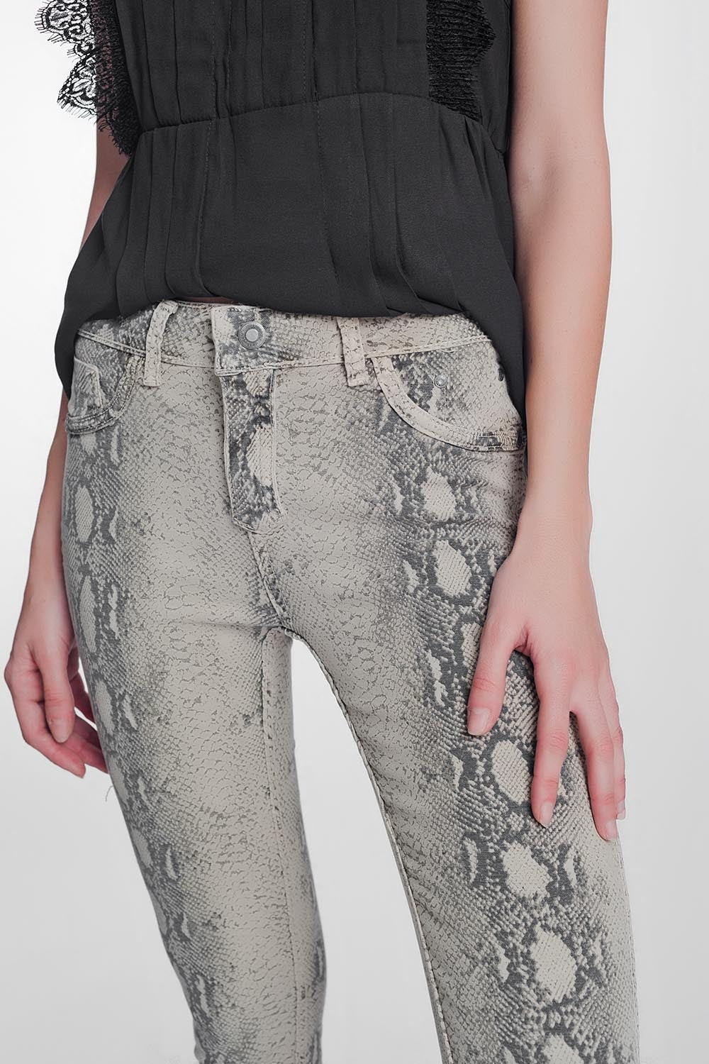 beige super skinny reversible pants with snake print