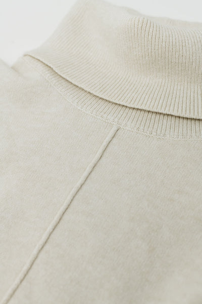 Beige turtleneck sweater with front seam