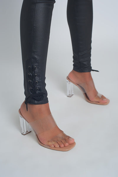 Black leather effect trousers with hem lace-up