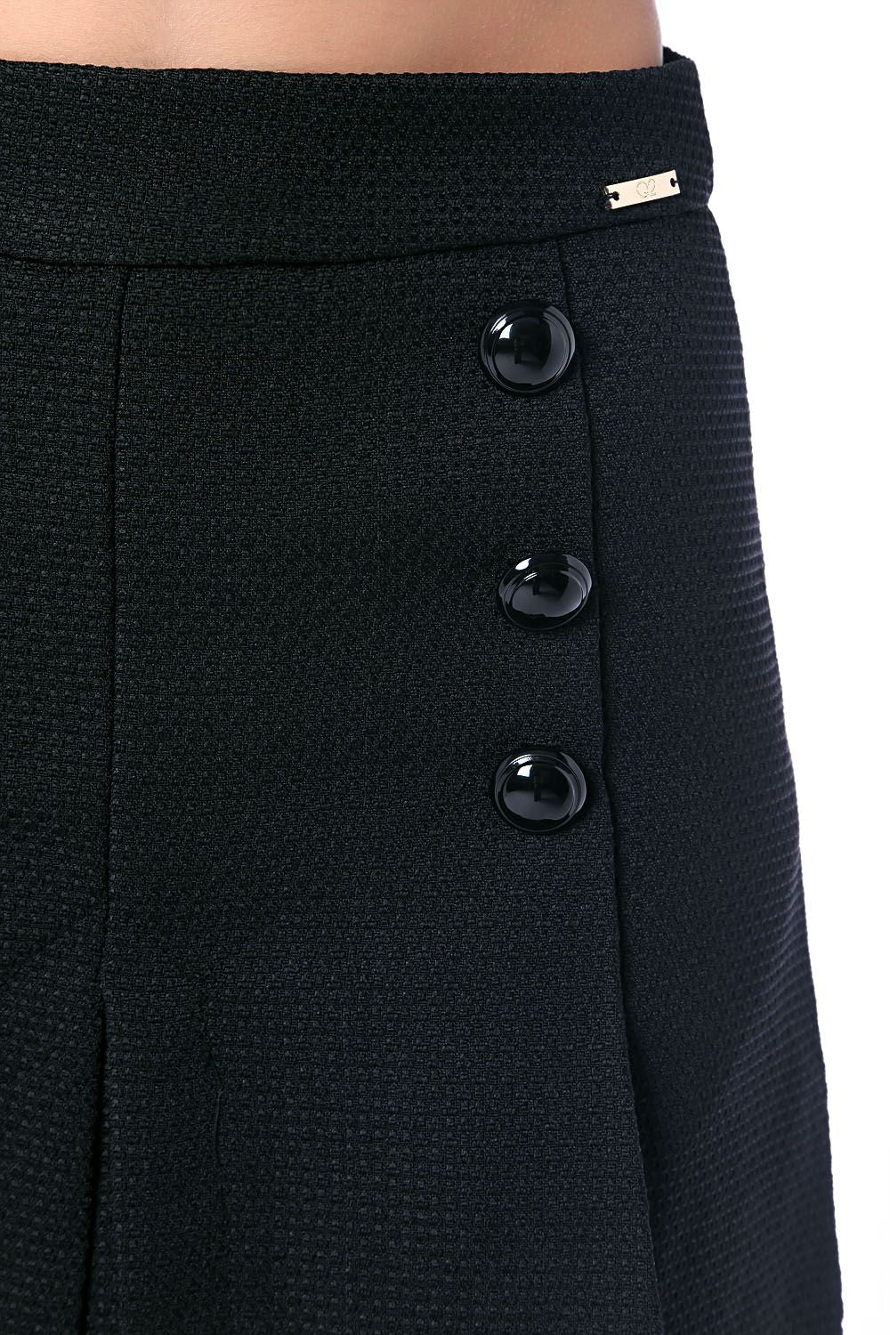 Black mini skirt with black button detail