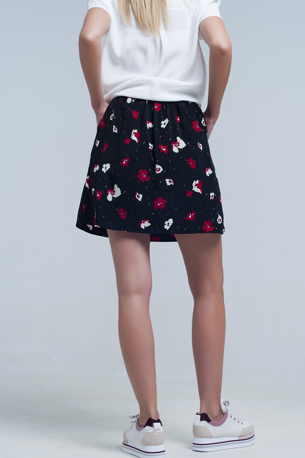 Black mini skirt with floral pattern