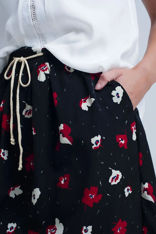Black mini skirt with floral pattern - Skirts