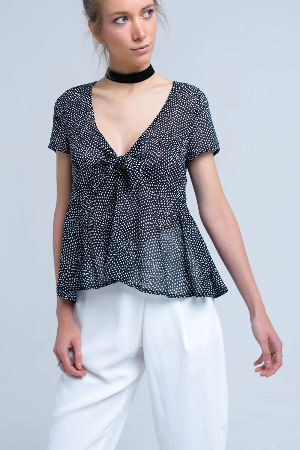 Black polka dot top with ruffle hem - Shirts