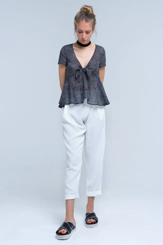 Black polka dot top with ruffle hem - Shirts