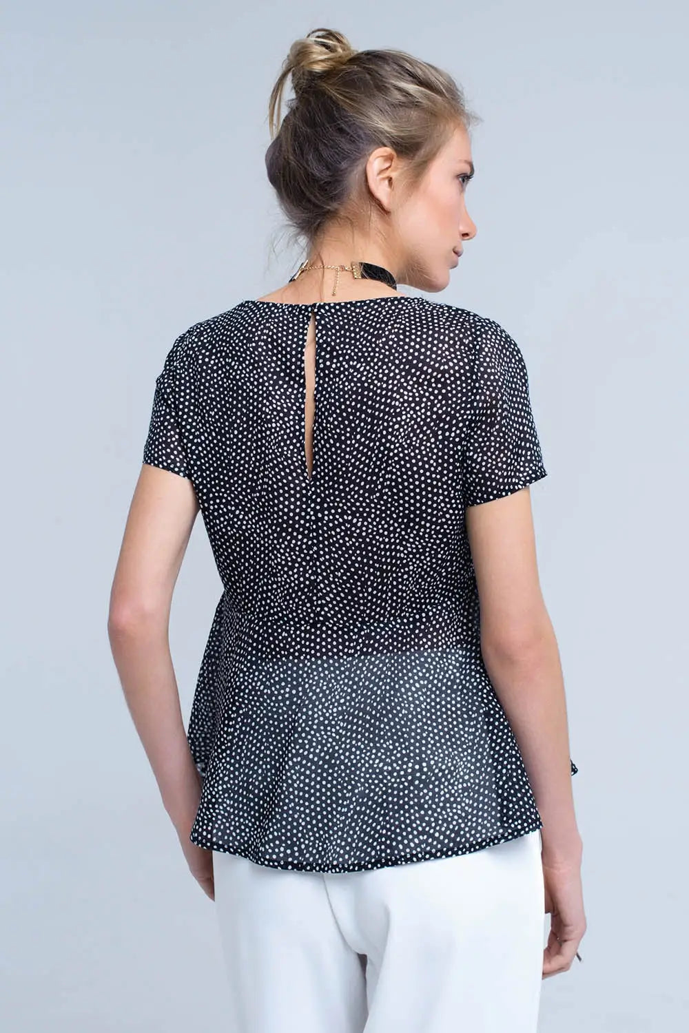 Black polka dot top with ruffle hem - Shirts