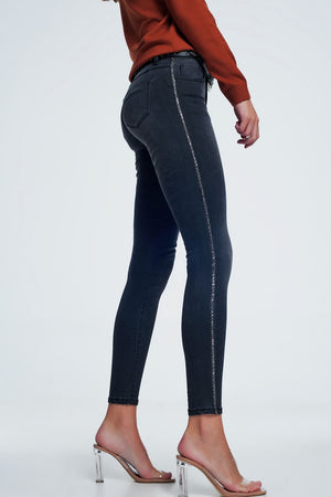 Q2 Black skinny jeans with shiny stones detail on the side