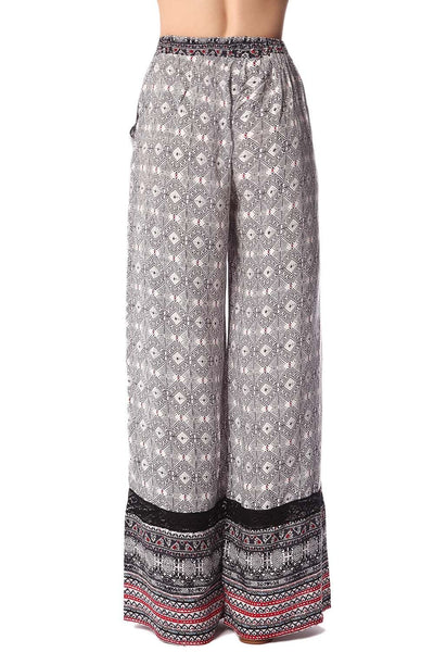 Black wide leg pants in ethno print with eyelash lace insert