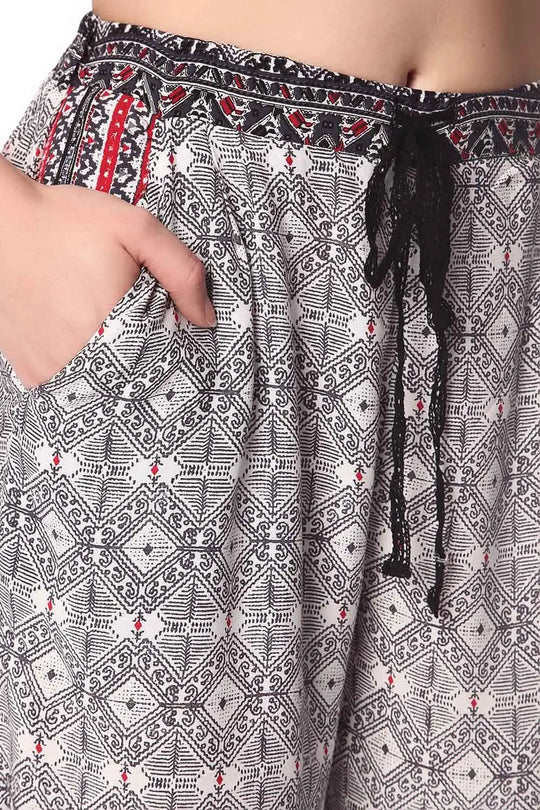 Black wide leg pants in ethno print with eyelash lace insert - Pants