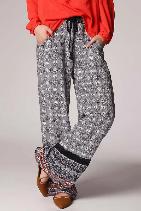 Blue pants in ethno print with wide leg and eyelash lace insert - Pants