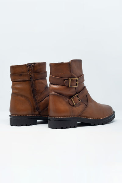 Brown buckled boots