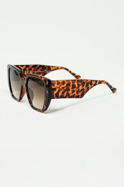 Brown pin-up style sunglasses with geometric design and cat eyes