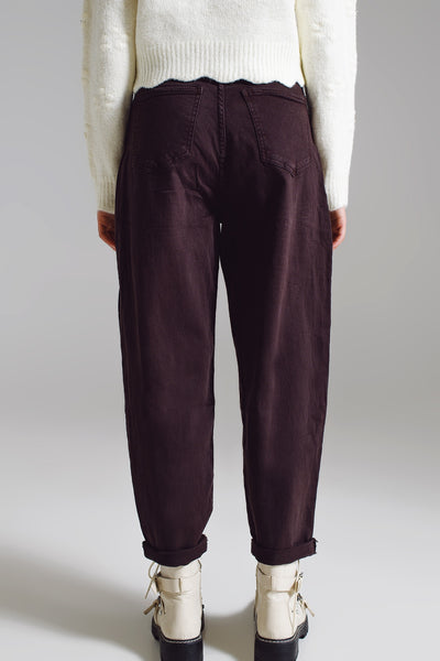 Brown relaxed pants with pocket detail at the waist