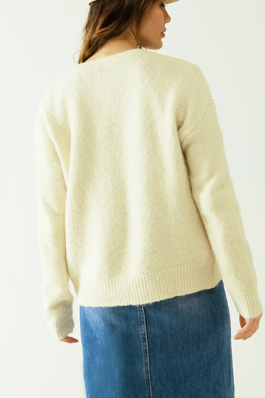 Cardigan à manches longues de couleur crème avec fermeture sur le devant par des boutons - Pulls