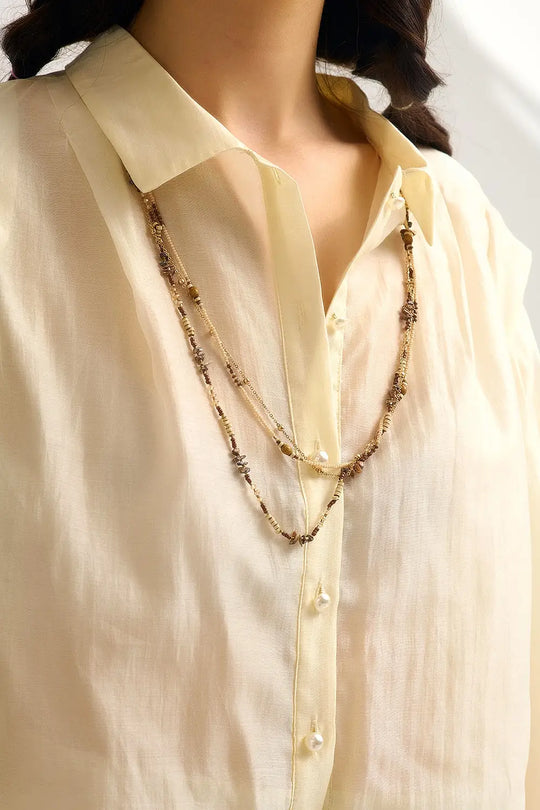 Chemisier en soie Tencel crème avec manches ballon et boutons en nacar - Tee-Shirt