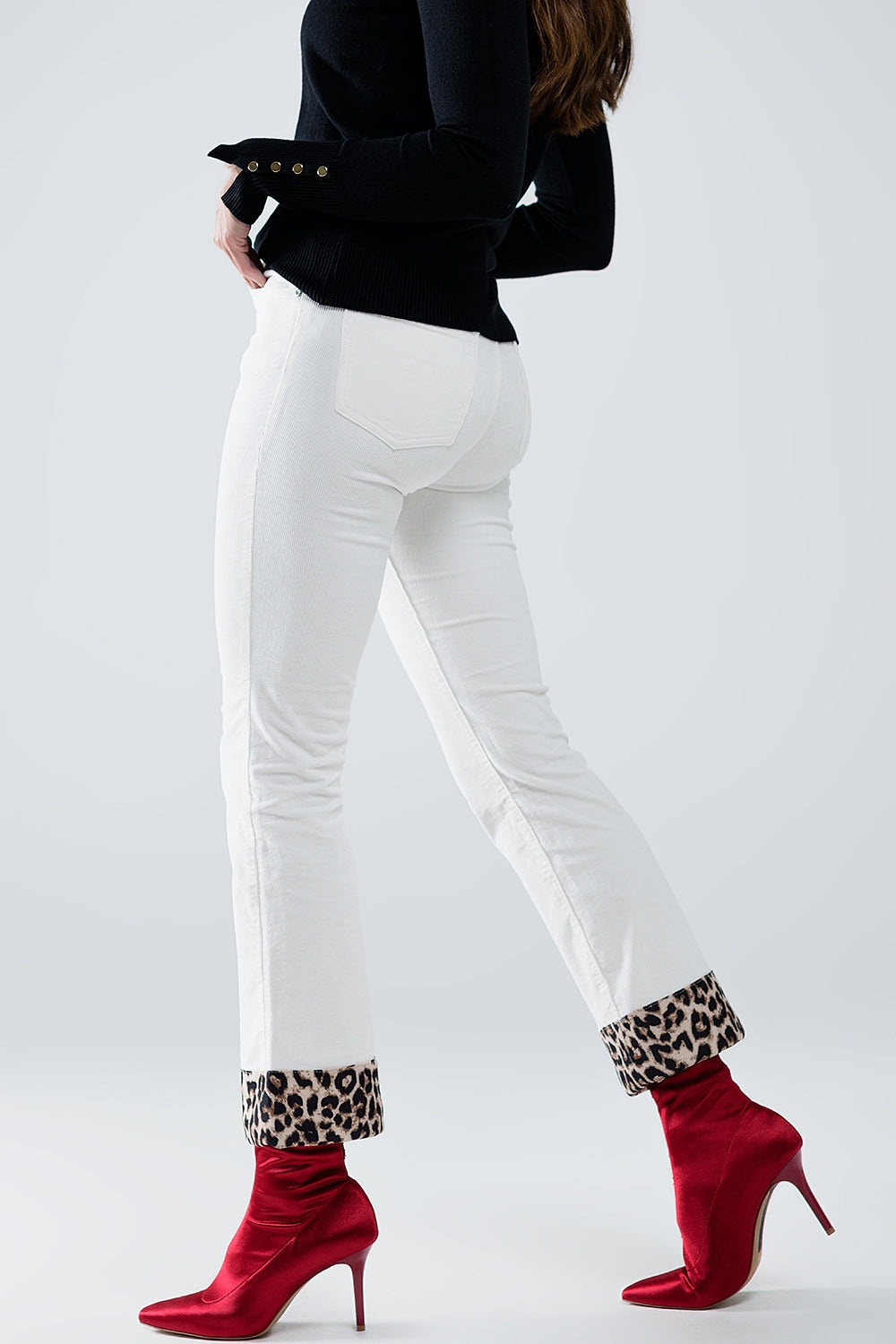 Cream Corduroy flare pants with leopard print at the bottom