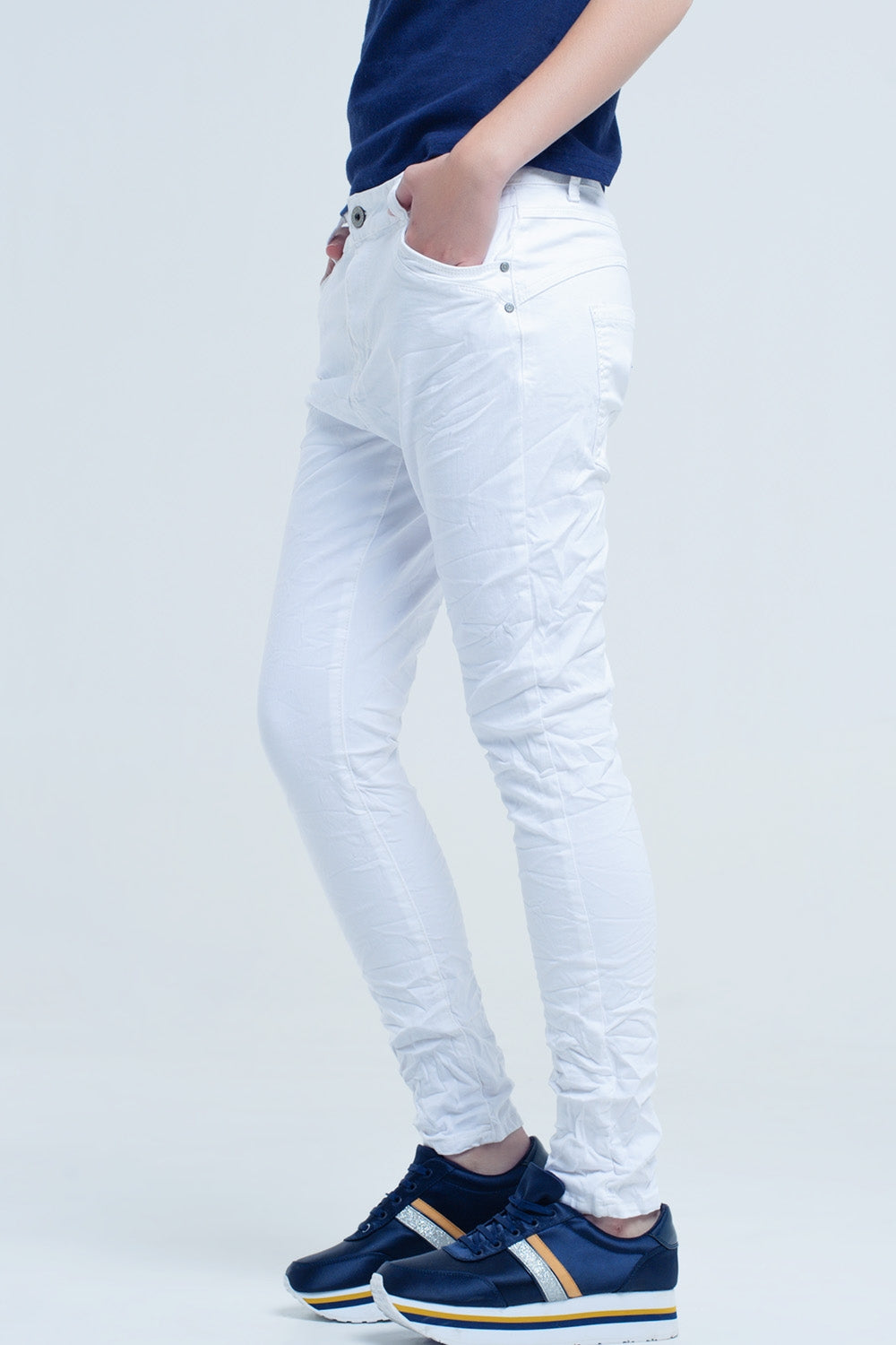 Crumpled white jeans with pockets