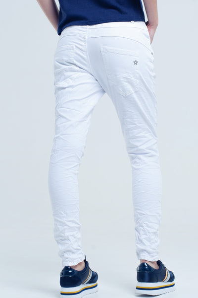 Crumpled white jeans with pockets