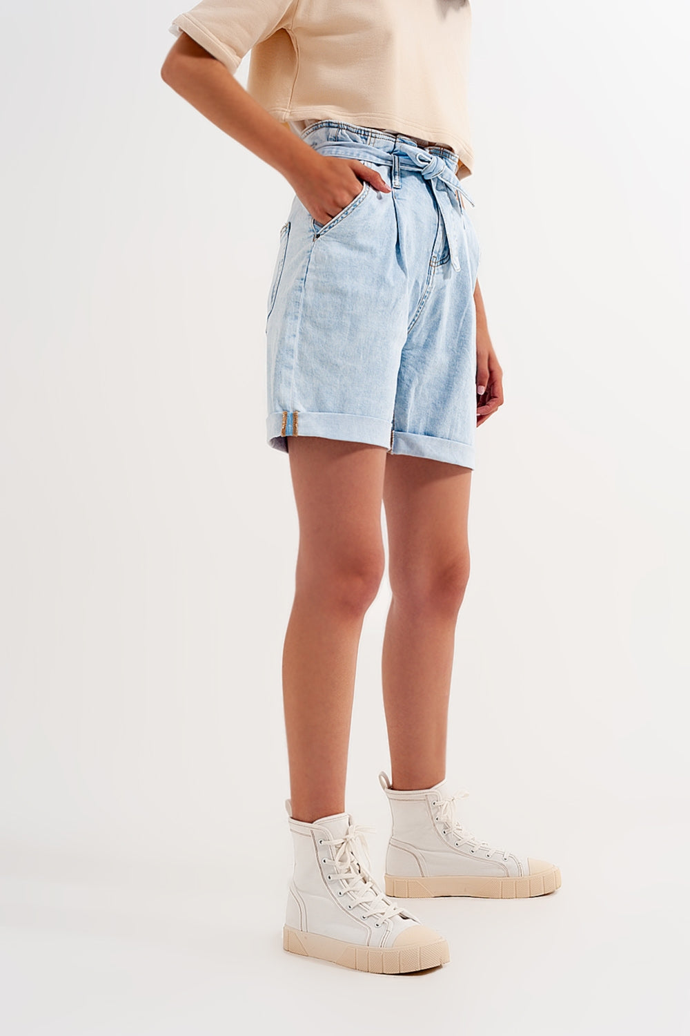 Denim shorts with light blue wash and waist tie