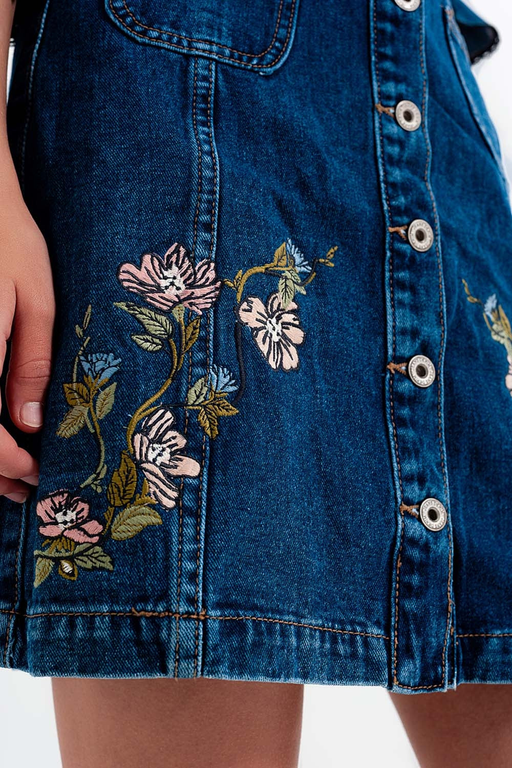 Denim skirt with flower embroidery and front buttons