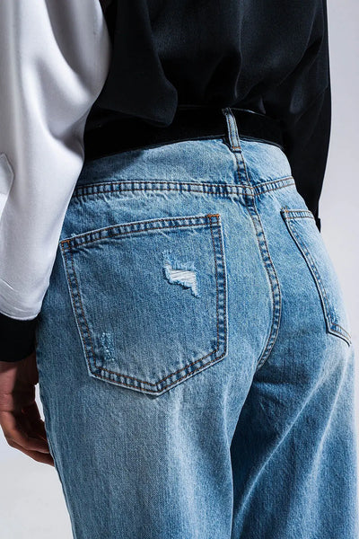 Distressed straight leg jean in medium denim - Jeans