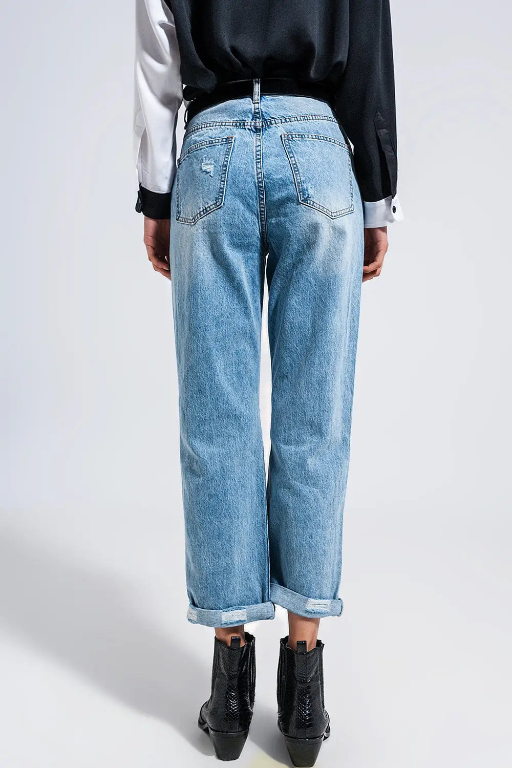 Distressed straight leg jean in medium denim - Jeans