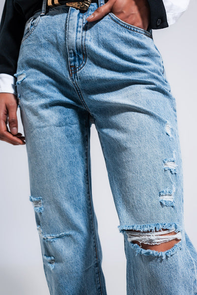 Distressed straight leg jean in medium denim