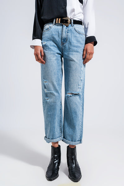 Distressed straight leg jean in medium denim