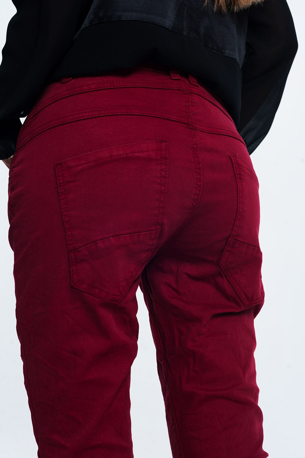 Drop crotch skinny jean in maroon