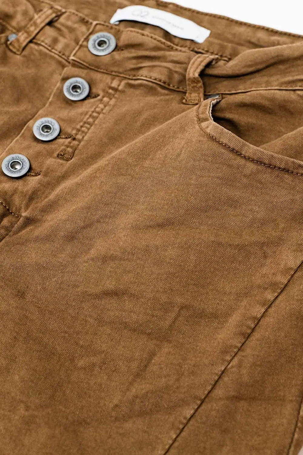 Exposed buttons skinny jeans in brown - Pants