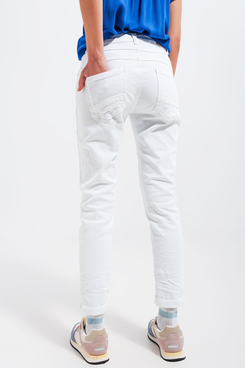 Exposed buttons skinny jeans in white