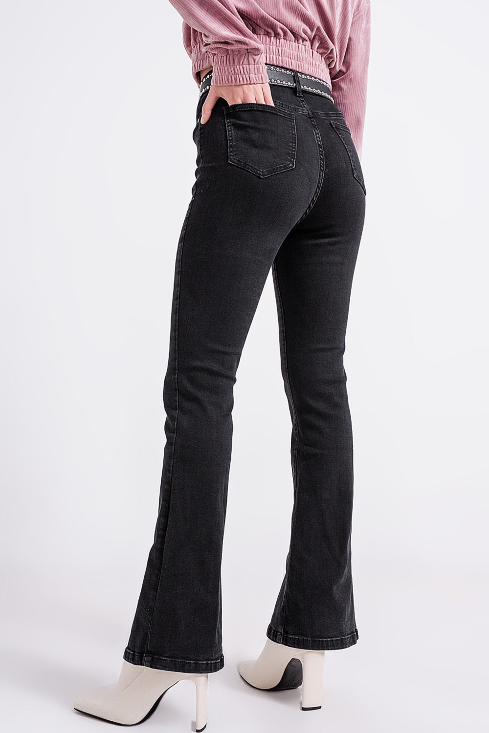 Flare black jeans with split hem