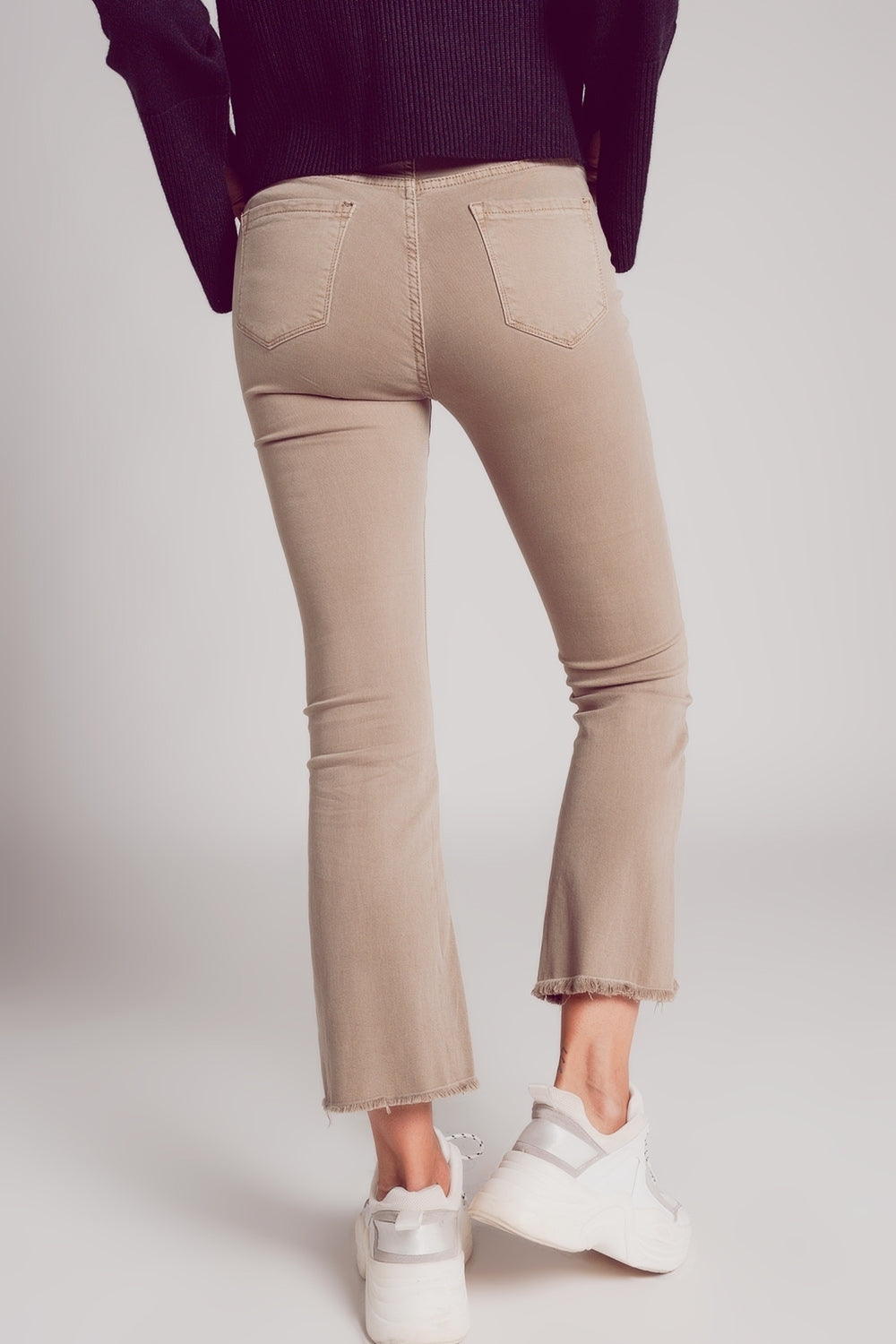 Flare jeans with raw hem edge in beige