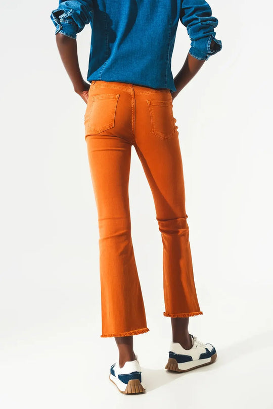Flare jeans with raw hem edge in orange - Jeans