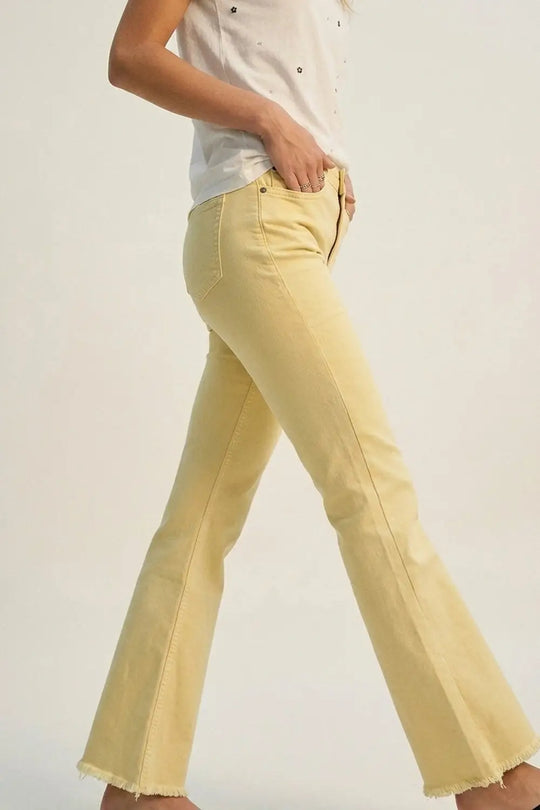 Flare jeans with raw hem edge in yellow color - Jeans