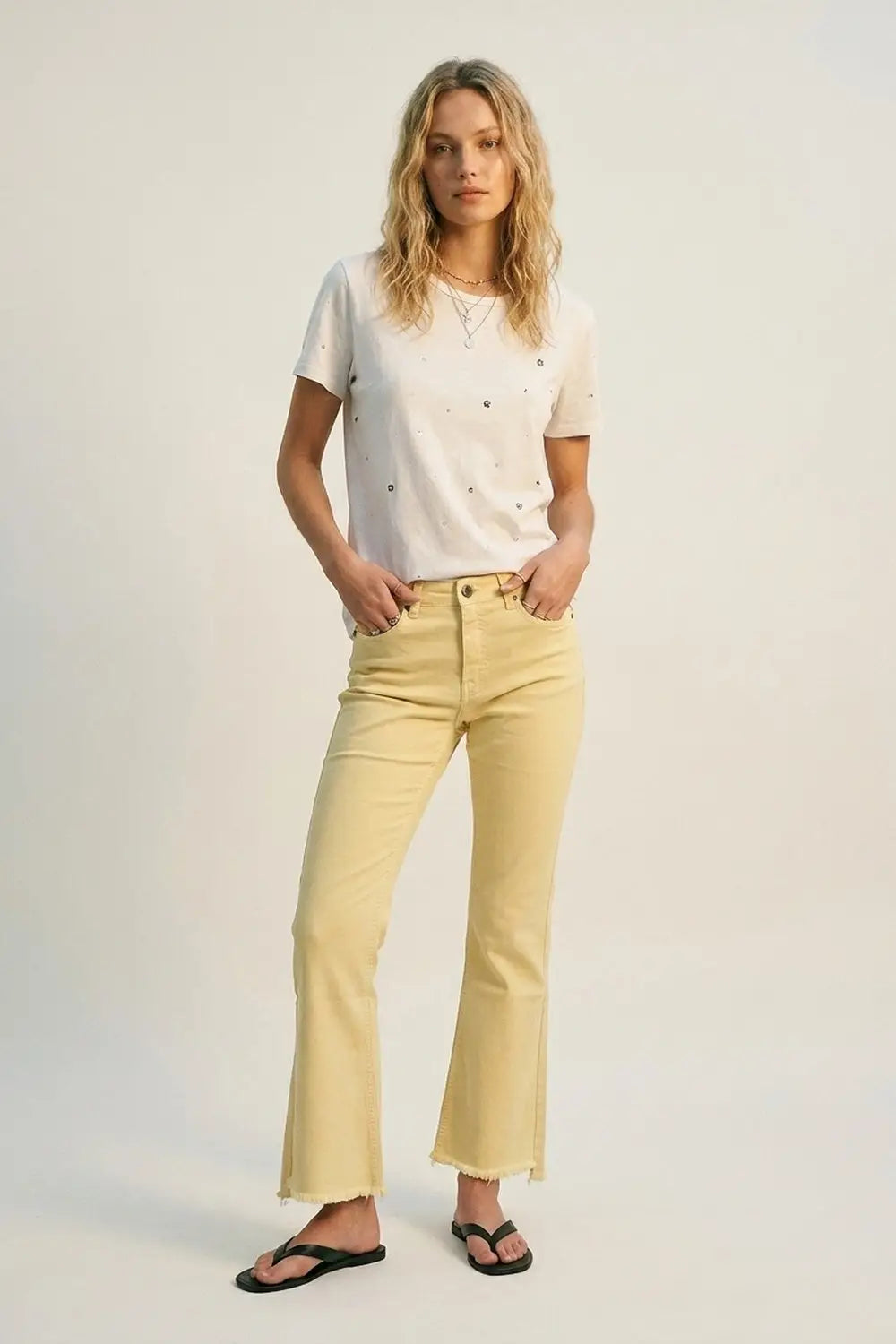 Flare jeans with raw hem edge in yellow color - Jeans