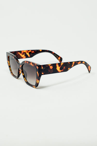 geometric polarized sunglasses with gradient dark lenses and tortoise shell